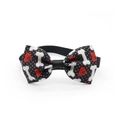 Detail of a black pet bowtie featuring white bone and red heart patterns for dogs and cats - Style 8-Black Bone Hearts