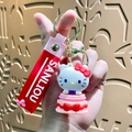 Hello Kitty keychain with pink tiered cake charm and red silicone wrist strap - Sanrio Cake-Hello Kitty