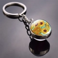 Close-up of metal keychain featuring Van Gogh Sunflowers art in a round glass dome - Sunflower