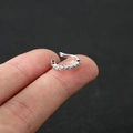 Elegant silver ear cuff with sparkling zircon stones held between fingertips - Style 1 / Silver