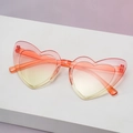 Heart shaped sunglasses with orange gradient lenses and transparent plastic frame - Orange to Yellow Gradient
