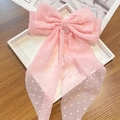 Detail of pink chiffon oversized bow hair clip featuring textured 3D raised dots - Long Streamer Spring Clip / Pink Polka Dot
