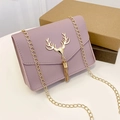 Fashionable lavender quilted chain bag featuring a decorative metal deer charm - Purple