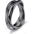 Detailed macro shot of interlocking triple-band titanium rings with a matte black finish - US 5 / Black