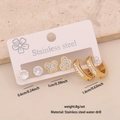 Three pairs of golden stainless steel stud earrings with white rhinestones on display - Rhinestone Butterfly (6#)