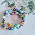 Double-layer colorful glass bead bracelet with floral patterns and elastic design - Millefiori Glass Flower Bead