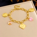 Vintage gold charm bracelet featuring pink heart crystal and rose flower pendants - Retro Rose Portrait Coin Style (B1677)