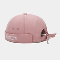 Detail of pink canvas brimless hat with white Brooklyn embroidery and adjustable metal buckle - Dusty Pink