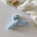 Plush light blue shark hair claw clip for women featuring soft faux fur texture - Teal