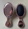 Rose gold hairbrush with mirror finish and black air cushion bristles for hair massage - Plated Bronze