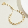 Adjustable 14K gold plated beaded bracelet featuring elegant white pearls and bolo clasp - 6mm