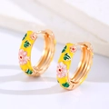 Macro view of yellow enamel hoop earrings with colorful floral pattern and gold plating - Yellow (Copper)