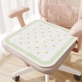 Square white chair cushion with yellow hearts and green border on a pink office chair - Refreshing