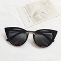 Retro black cat-eye sunglasses with gold metal triangle accents and dark lenses - Black
