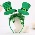 Detail of St. Patrick's Day headband featuring green mini hats and shamrock sequins - Style 11 - Tinsel Polka Dot Hat Shamrock Headband