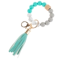 Close-up of MAMA silicone bead keychain with teal faux leather tassel and gold ring - Lake Blue