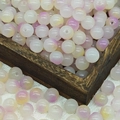 Detailed view of 10mm gradient purple glass beads scattered around a vintage wooden box - 10mm / N14# Yellow Purple (10MM)