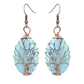 Detail of handmade wire wrapped tree of life earrings with oval turquoise stones - Antique Copper + Synthetic Turquoise