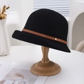 Women's black breathable cotton linen bucket hat with brown leather strap on wood stand - Black