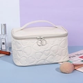 Creamy white Y2K heart embossed cosmetic bag with glossy finish and dual ring zippers - Rectangular Storage Bag / White