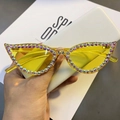 Close-up of yellow cat-eye sunglasses with colorful AB rhinestones and tinted lenses - Yellow Lens