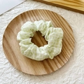 Elegant scrunchie with light green and white plaid pattern on a rustic wooden tray - Light Green Plaid