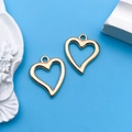 Two KC gold hollow heart pendants for DIY jewelry making on a blue background - 1pc KC Gold Hollow Heart Shape 15x18mm