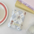 Detail of blue quilted fabric passport holder with cute bear patterns and Sozakka label - Diamond Bear