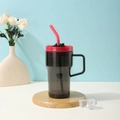Gray translucent plastic straw cup with red lid and black handle on a wood base - 20oz / Black