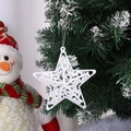 Stella di Natale bianca traforata con glitter appesa a un ramo di albero di Natale - Stella 3D / 10cm