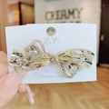 Golden butterfly hair clip with crystal rhinestones on a white handmade jewelry card - Butterfly Knot White Spring Clip