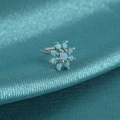 Macro view of snowflake nose stud with turquoise stones on dark teal silk fabric - Style C / Blue Turquoise