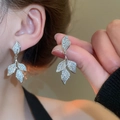 Close-up of sparkling silver leaf tassel earrings with pavé set zircon crystals - 66# Silver Earring Post - Silver