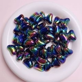 Detailed pile of colorful UV coated bow beads for DIY craft and jewelry making - Black