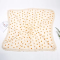 Dettaglio della coperta in mussola di cotone con stampe di arance e bordi con nappe - Arancia