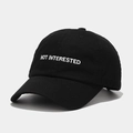Detailed view of black cotton baseball cap with white NOT INTERESTED embroidery - M(56-58cm) / Black
