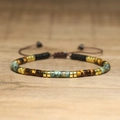 Macro detail of hand-woven bracelet with turquoise, tiger eye beads and gold spacers - No.71 Tiger Eye Matte Black