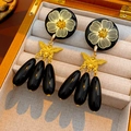 Detail of vintage gold flower and butterfly earrings with black teardrop pendants - Silver Pin-Gold-Black (Earrings)