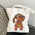 White canvas tote bag featuring colorful mandala dachshund print on a black chair - C11 / No Inner Pocket No Zipper