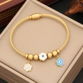 Macro detail of gold evil eye flower charms and rhinestones on a stainless steel bracelet - Floral Evil Eye Style(5#)