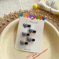 Set of four cute black and white checkered heart fabric hair clips on display card - Black and White