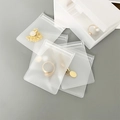 Set of transparent EVA storage bags for jewelry and small toys on a grey background - Frosted EVA (7*10CM)