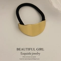 Minimalist gold metal hair tie with brushed finish and black elastic band for ponytails - Irregular Oval Stripe Gold