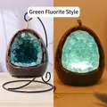 Green fluorite crystal night light with glowing stones and dark polished exterior shell - Dinosaur Egg Night Light - Green Fluorite