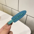 Close-up of a matte Morandi blue hair clip with spring mechanism for styling - Jelly Seamless Clip / 6.7cm / Teal