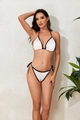 Detail of white textured fabric and black trim on a two-piece triangle bikini set - S / White with Black Trim
