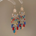 Detailed close-up of bohemian chandelier earrings with colorful beads and gold tassels - Ear Hook - Colorful