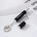 Detail of black rhinestone portable perfume bottle with metal keychain and spray nozzle - Black