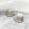 Macro view of silver wave texture fan shaped stainless steel earrings for women - Silver (N-232)
