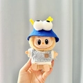 Plush doll accessory featuring a grey textured sweater and blue eye-patterned hat - Keychain With Big Blue Sesame Hat And Blue Circle Smiley Face Shirt / First And Second Generation Keychains Are Compatible With La Cloth Dolls. Dolls Not Included.